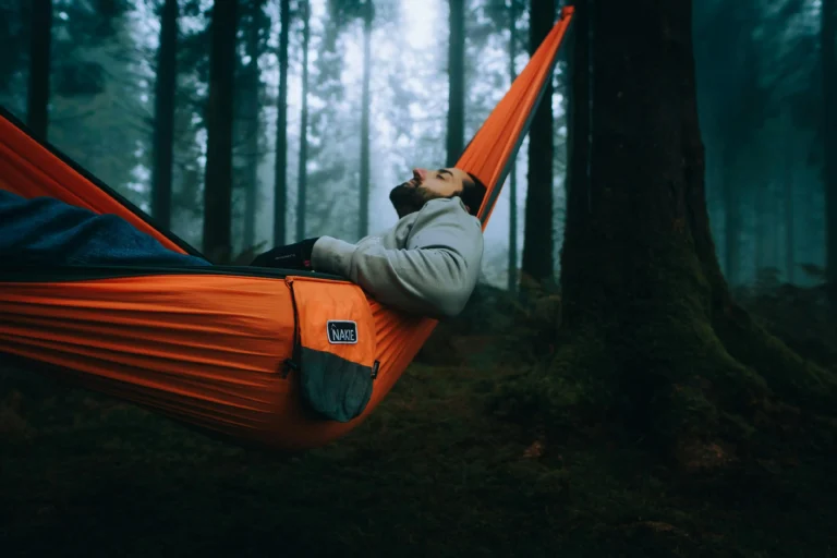 Ultralight backpacking hammock under 1 lb set up in forest campsite