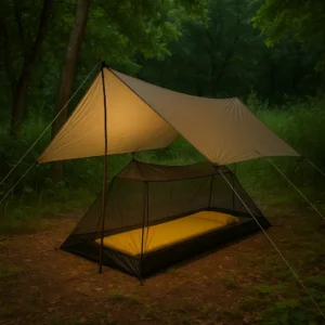 Ultralight bug protection for hot, humid nights — mesh shelter under a high-pitched tarp at a summer campsite