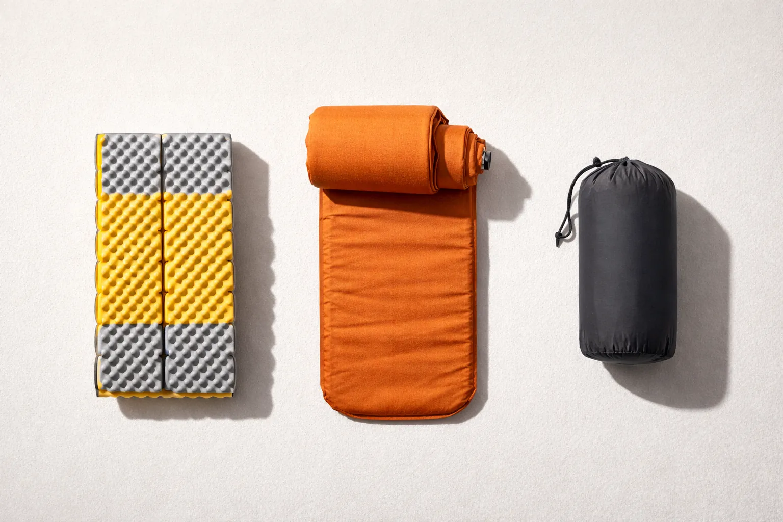 Three common sleeping pad types: foam, self-inflating, and inflatable.